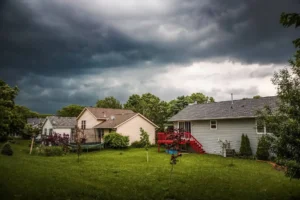 a neighborhood with storm clouds overhead