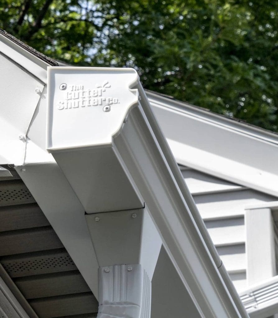 a house with gutter shutter branded gutters installed